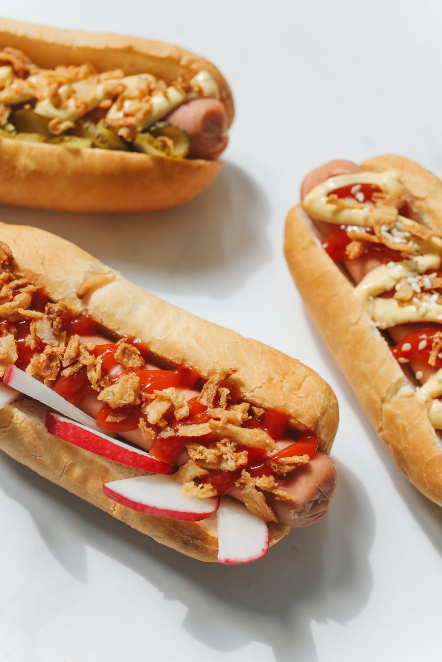 close up photo of hotdog sandwiches